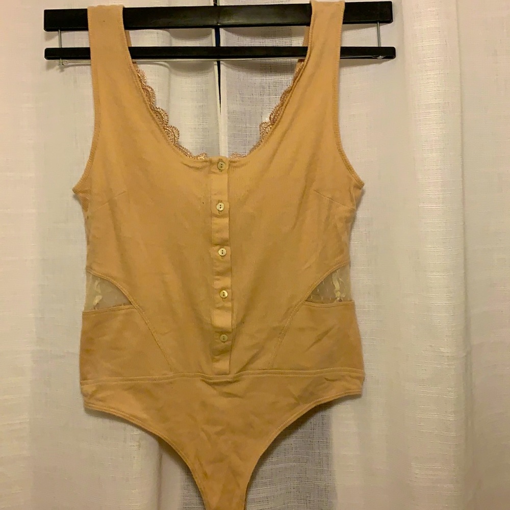 Cream bodysuit with lace cutout